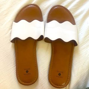 Flat slide on white shoes